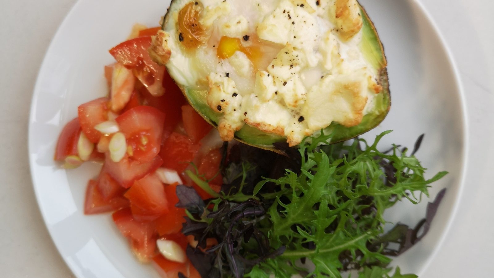 Baked avocados and salad