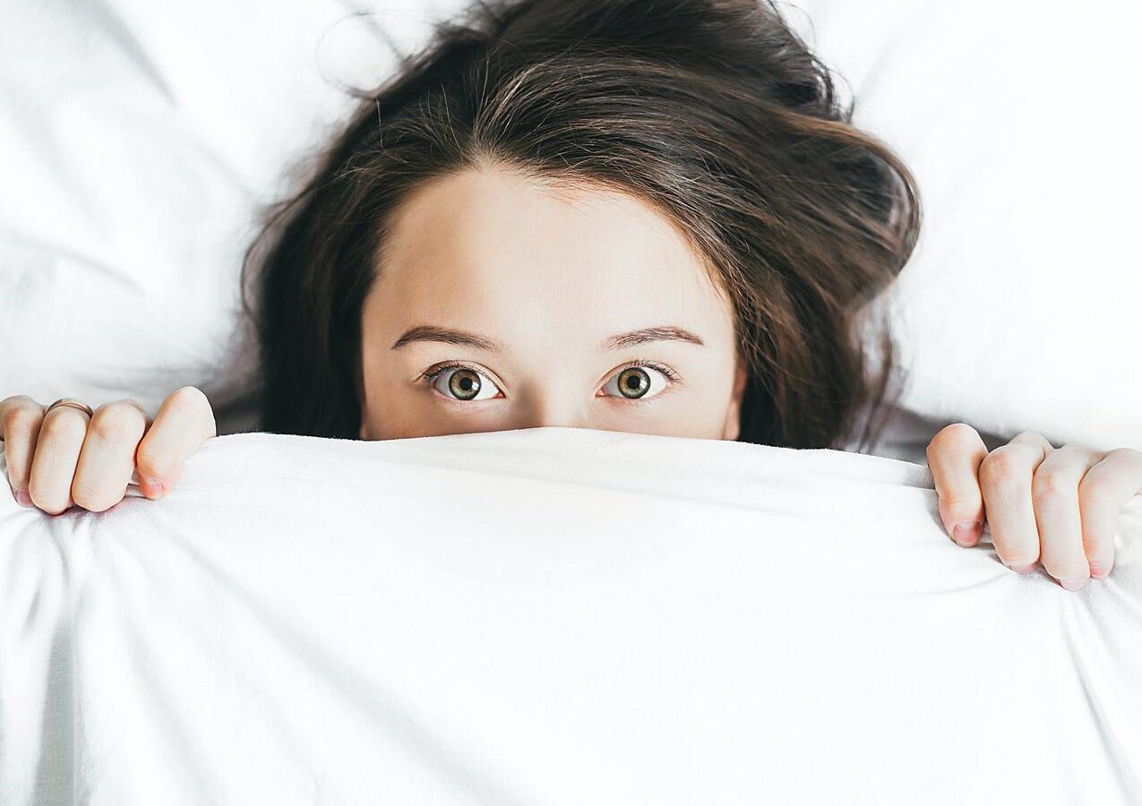 Lady in bed with poor sleep