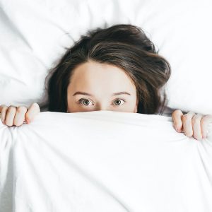 Lady in bed with poor sleep