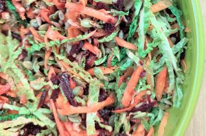Cabbage, carrot and beetroot coleslaw in bowl