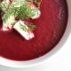 Beetroot soup in bowl with feta and dill