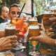 Friends raising glasses in bar